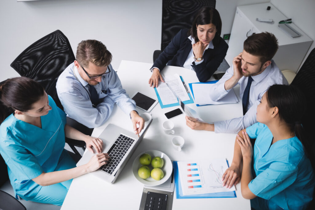 insurance executives with doctors